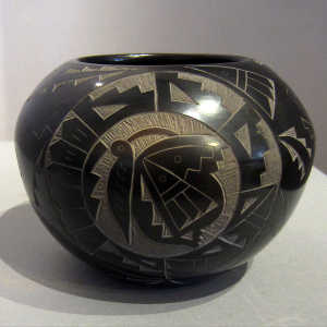 Sienna spot and sgraffito butterfly, hummingbird, Yei and geometric design on a black seed pot