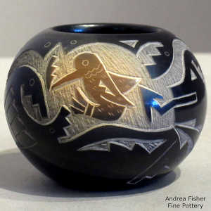Sienna spot and sgraffito hummingbird, avanyu and geometric design on a black seed pot