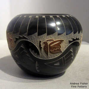 Sienna spots and sgraffito butterfly, hummingbird, avanyu and geometric design on a black seed pot