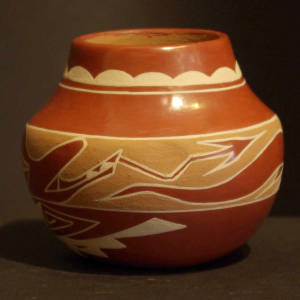 Avanyu, cloud and geometric designs on a polychrome jar