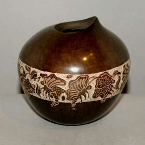 Sgraffito band with butterfly design on a polished brown jar with an organic opening