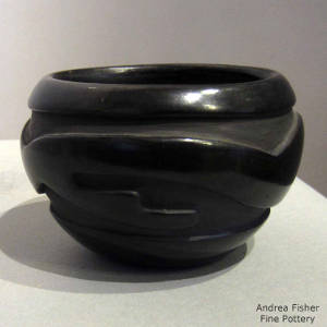 Traditional Santa Clara geometric design carved into a black bowl