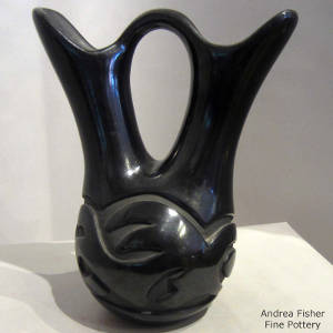 Geometric design carved into a black wedding vase