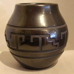 Kiva step and geometric design carved into a black jar