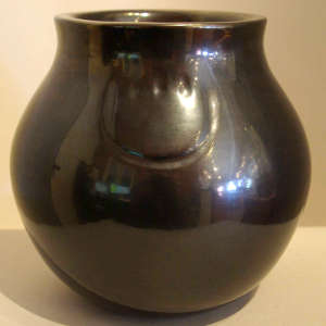Bear paw imprint on a polished black jar