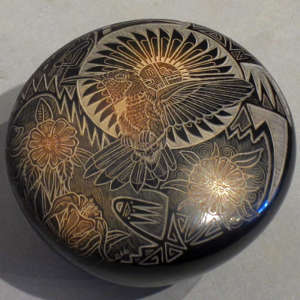 Sgraffito wildlife scene with traditional geometric designs and sienna spots on a black seedpot