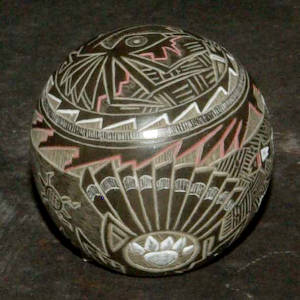 Sgraffito spider, featrher and geometric design on a black seed pot