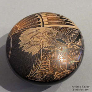 Sgraffito eagle, feather, pueblo and geometric design on a black seed pot