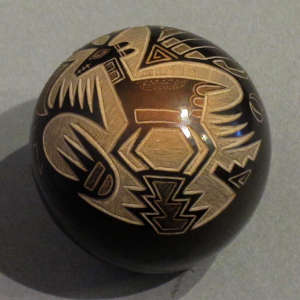 Sgraffito animal and traditional geometric designs with sienna spots on a black seedpot