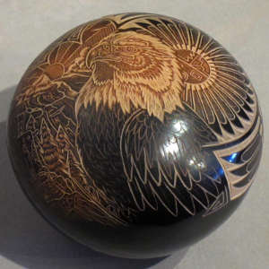 Sgraffito wildlife design and sienna spots on a black seedpot