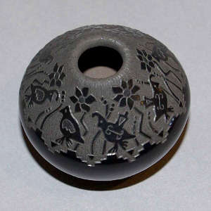 Sgraffito quail, flower and geometric design on a black seed pot