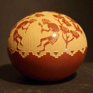 Sgraffito hummingbird, kokopelli and flower motif on a red seedpot
