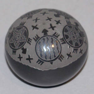 Sgraffito turtle and geometric design on a black seed pot