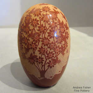 Sgraffito hummingbird and floral design on a red seed pot