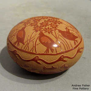 Sgraffito turtle, quail, floral, avanyu and geometric design on a red seed pot