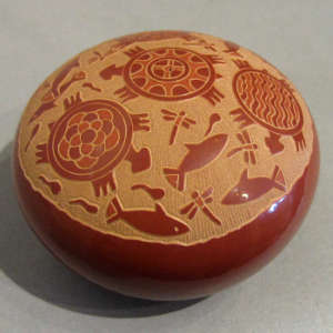 Sgraffito turtle, fish and dragonfly design on a red seedpot