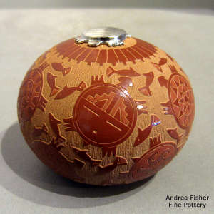 Sgraffito turtle, fish and geometric design on a red seed pot with a sterling silver turtle lid