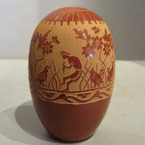 Sgraffito nature design on a red seedpot