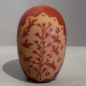 Sgraffito hummingbird, butterfly, floral and kiva step design on a red seedpot