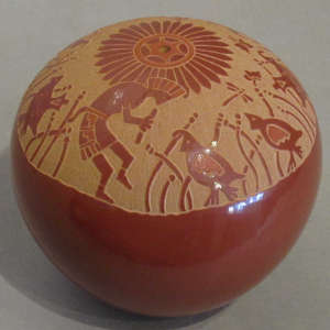 Sgraffito flute player, quail and geometric design on a red seedpot