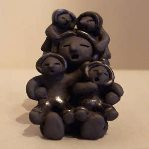 Four children on a black storyteller