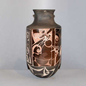 Four panel sgraffito goose and geometric design on a black and brown jar
