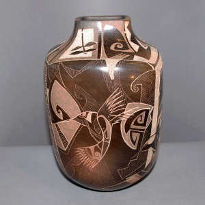 Sgraffito hummingbird and geometric design on a brown jar