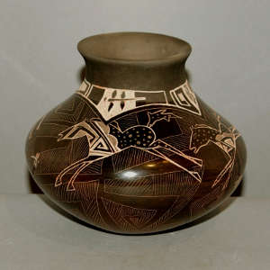 Sgraffito horse and geometric design on a brown jar