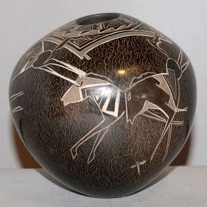 Sgraffito horse and geometric design on a brown jar