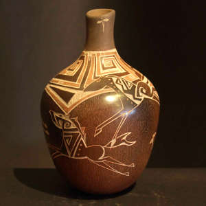 Sgraffito horses, dragonflies and geometric design on a brownware vase