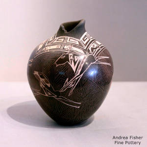 Sgraffito horse and geometric design on a brown jar