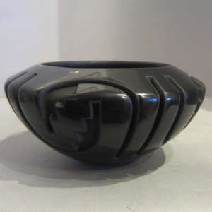 Geometric designs carved in a black bowl