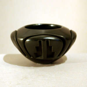 Geometric design carved into a black bowl