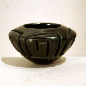 Geometric designs carved into a black bowl