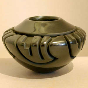 Kiva step and geometric design carved into a polished black bowl