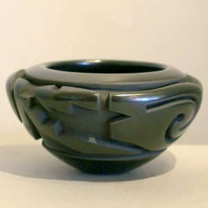 Avanyu design carved into a polished black bowl