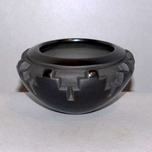 Kiva step design carved in a polished black bowl