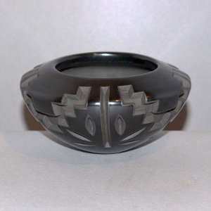 Kiva step and geometric design carved into a black bowl