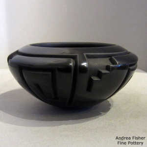 Kiva step and geometric design carved into a black bowl
