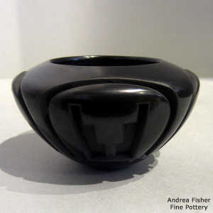 Four-panel kiva step and geometric design carved into a black bowl