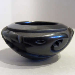 Geometric designs carved into a black bowl