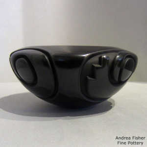 Kiva step, spiral and geometric design carved into a black bowl