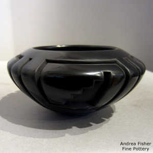 Four direction square spiral, kiva step and geometric design carved into a black bowl