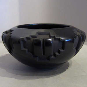 Geometric designs carved into a black bowl