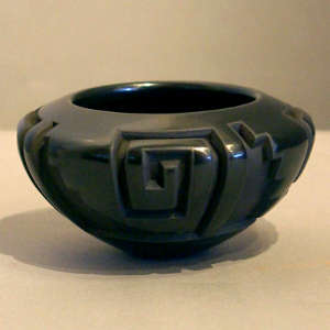 Four-direction kiva step and geometric design carved into a polished black bowl