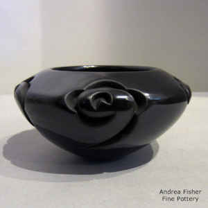 Geometric design carved into a black bowl
