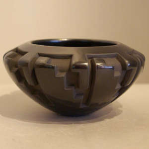 Kiva step and geometric design carved into a black bowl