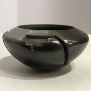 Geometric design carved into a black bowl
