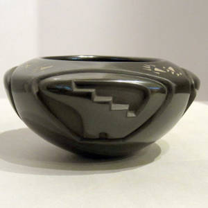 Four direction bear and kiva step design carved into a black bowl, plus sgraffito bear paws