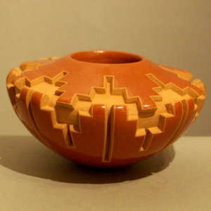 Double kiva step design carved into a low shouldered red jar